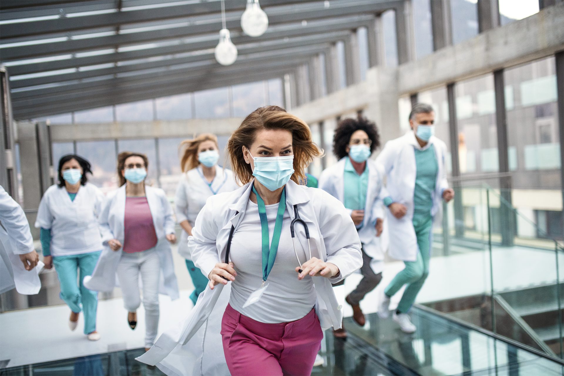 health professionals running in a building